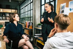 A good leader talking to team members