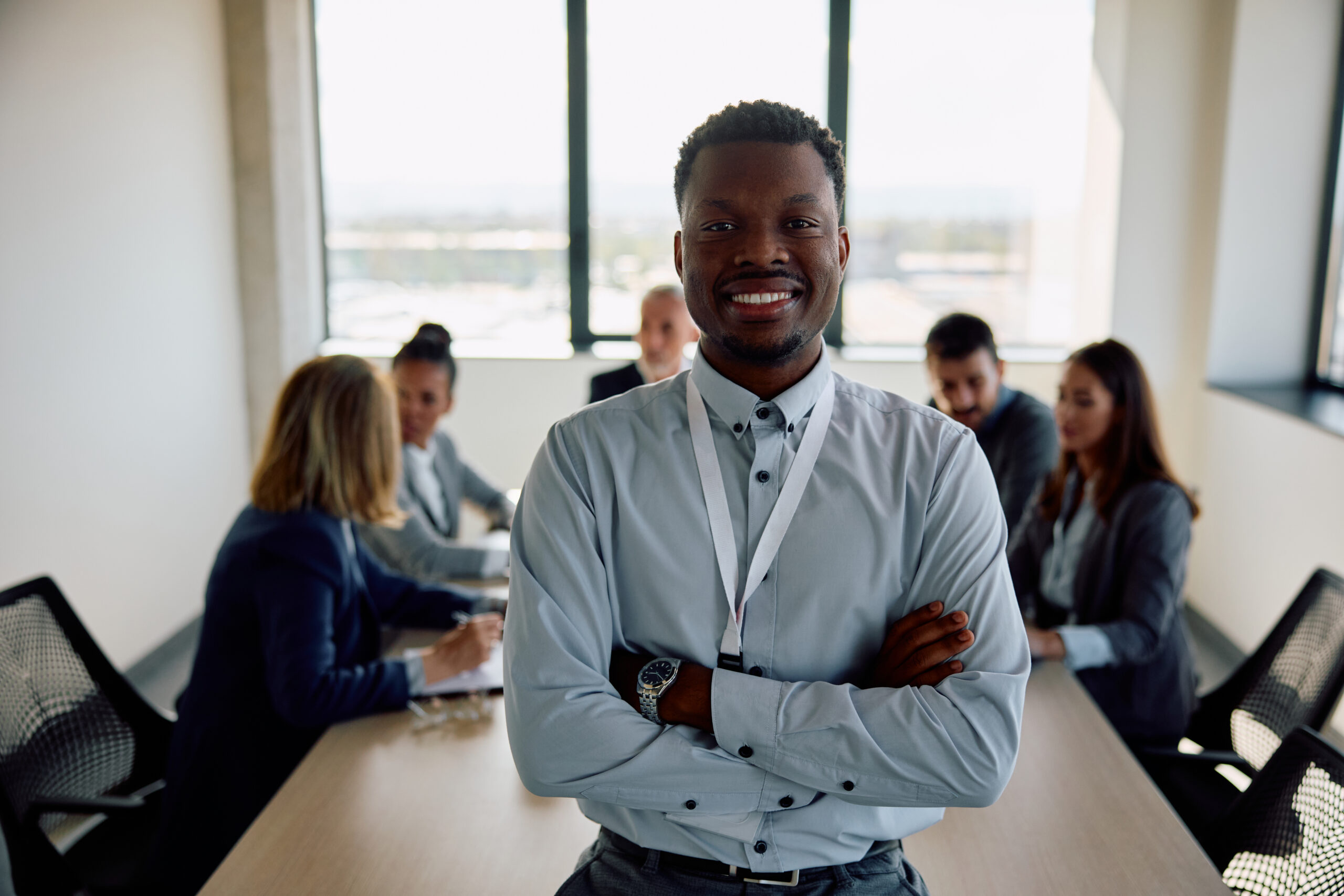 A customer acquisition strategist crossing their arms