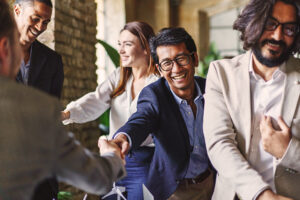 A smiling salesperson with a sales mindset